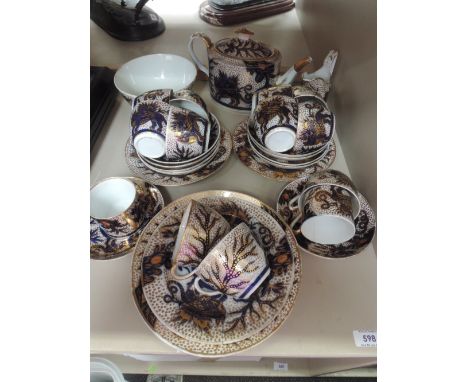 A 19th century gilt heightened tea service having Oriental mythological pattern decorationSOME DAMAGE,MANY CRACKS AND WEARNO 