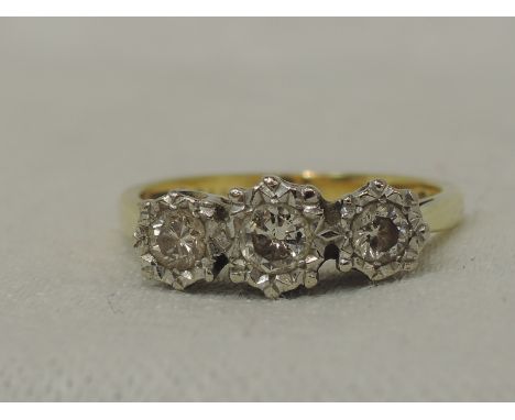 A lady's dress ring having a trilogy of diamonds, total approx 0.49ct in an illusionary mount on an 18ct gold loop, size P4.1