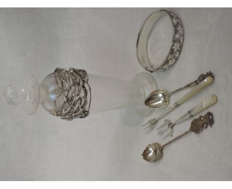 A selection of HM silver and white metal items including hinged bangle, mother of pearl handled pickle forks, teaspoons and a