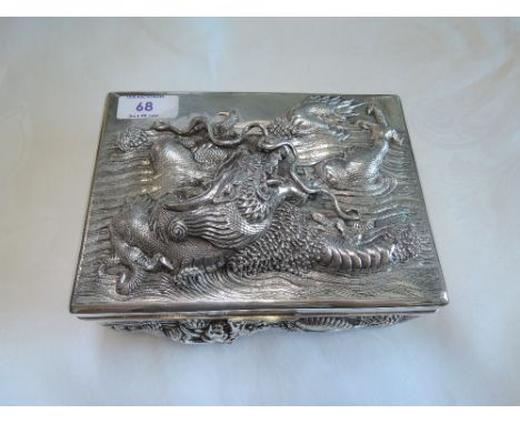 A Chinese silver cigarette box marked ZEEWO with Chinese mark having extensive embossed Chinese Sea Dragon decoration to lid 