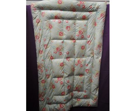 A vintage floral single eiderdown, excellent condition.full and even