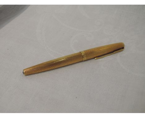 An 18ct gold Parker 61 fountain pen having engine turned decoration and plain cartouche, London 1964NO VISIBLE FAULTS OR REPA