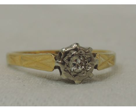 A lady's dress ring having a diamond solitaire, approx 0.25ct in an illusionary setting on an 18ct gold loop, size M2.8G