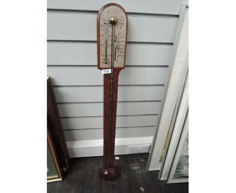 A modern reproduction stick barometer having arch crest by Comitti, Holborn