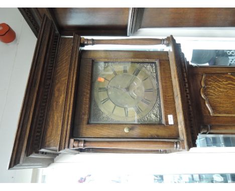 A late 18th century oak longcase clock having square pillar hood containing brass face and 30 hour movement by T Fayrer, Lanc