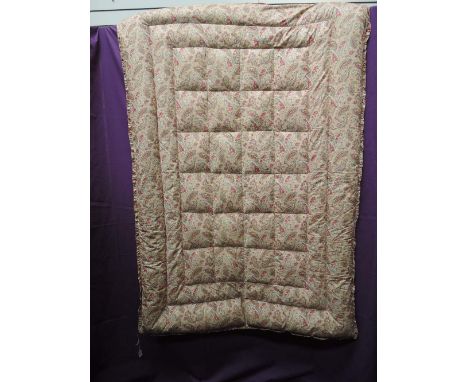 A vintage paisley single eiderdown with frilled edging,excellent condition.full and evenly distribated