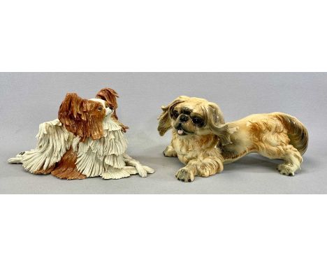 TWO CERAMIC DOG FIGURES comprising Eve Pearce Papillon, signed to base, 30.5cms (l) and a Goebel Pekingese, impressed marks, 