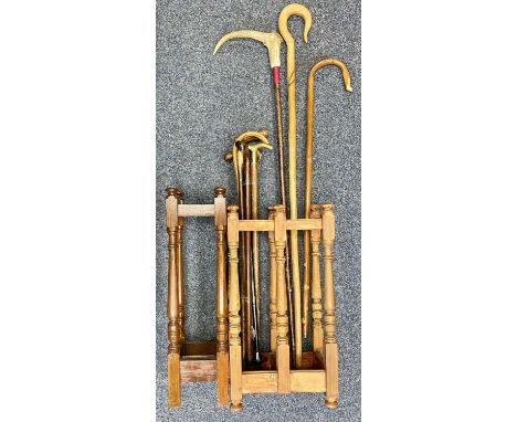 TEN SUNDRY WALKING STICKS / CROOKS, within two pine stick standsProvenance: private collection Conwy