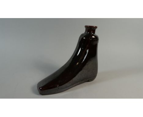 An Early 19th Century Treacle Glazed Pottery Shoe Flask. 19c16cms
