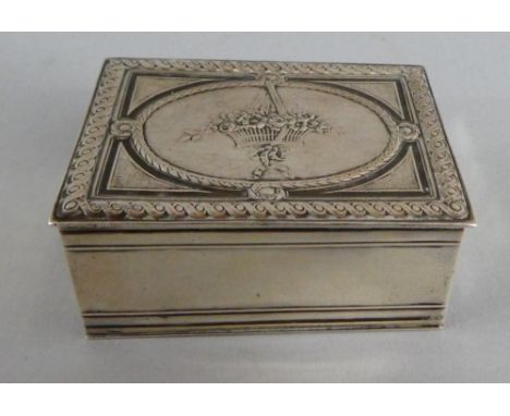 A Continental Silver Snuff Box. The Hinged Lid with Basket of Flowers in Relief. Bordered with Scrolling Ribbons and Geometri