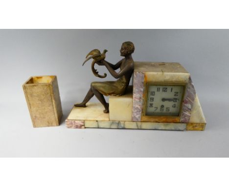 A French Art Deco Mantel Clock with Single Garniture Vase. Bronzed Spelter Mount Depicting Seated Maiden with Bird. 