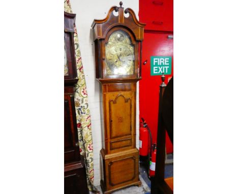 A 19th Century Long Case Clock. The Brass Face with Applied Pierced and Gilt Decoration, The Dial with Roman and Arabic Numer