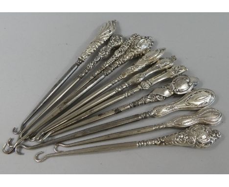 A Collection of Eleven Silver Mounted Button Hooks