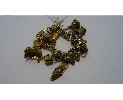 Rolled gold charm bracelet&nbsp;of double flattened-oval links and hung with 9ct gold charm of rococo mantel clock, 4.5g appr