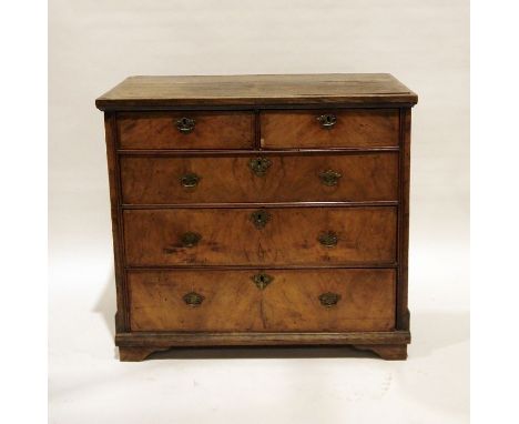 Early Georgian oak and walnut chest of two short over three long drawers, the rectangular oak top with applied edge over the 