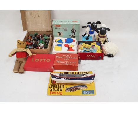 Assorted items to include Merit microscope set, plastic cowboys and indians, Shaun the Sheep items, a vintage puzzle, a Bayko
