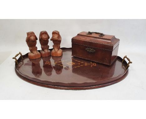 19th century mahogany tea caddy with brass handle and escutcheon, an oval and inlaid tray and three treen monkeys (5) 