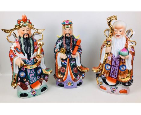 Three large contemporary Chinese ceramic figurines of the Three Immortals, Fuk, 30.5 by 20 by 55.5cm high, Luk 34 by 19 by 60
