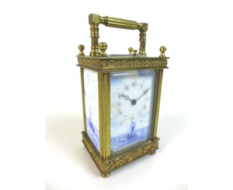 A French gilt brass and porcelain repeating carriage clock, late 19th century, with porcelain dial and sides decorated in blu