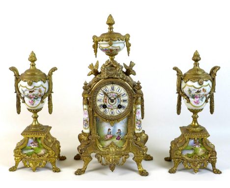 A French 19th century gilt metal clock garniture, with painted porcelain panels, urn surmount, 8 day movement chiming on a be