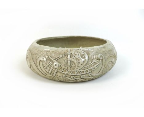 William Oram Trivett (British, 1872-1955), ceramic bowl, signed 'W.O. Trivett', with relief decorations of a trieme and a fri