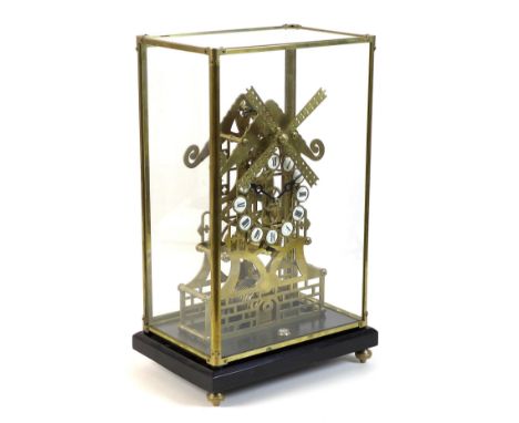 A Trigona brass skeleton clock in the form of a windmill, mid 20th century, with 8 day fusee movement, in brass framed five g