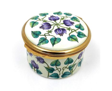 A modern Moorcroft enamel box clock, decorated with Florida Star pattern, of cylindrical form with hinged domed cover, openin