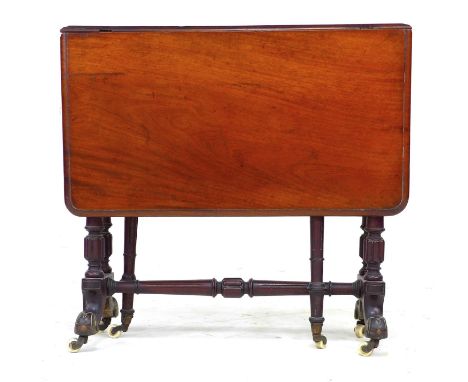 A Victorian mahogany Sutherland table, drop leaves, turned supports and white ceramic castors, 76.5 by 19 by 72cm high. 