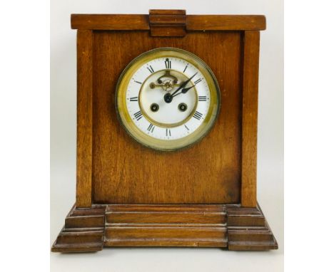 A mahogany mantel clock, the Art Deco case fitted with a 19th century French movement, 8 day duration striking the hours on a