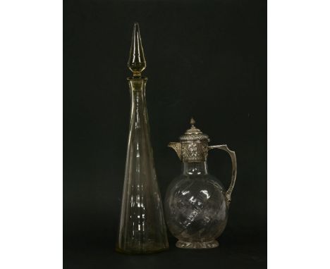 A Victorian silver topped claret jug, Charles Edwards, London 1899, the lid decorated in relief with flowerheads and scrollin