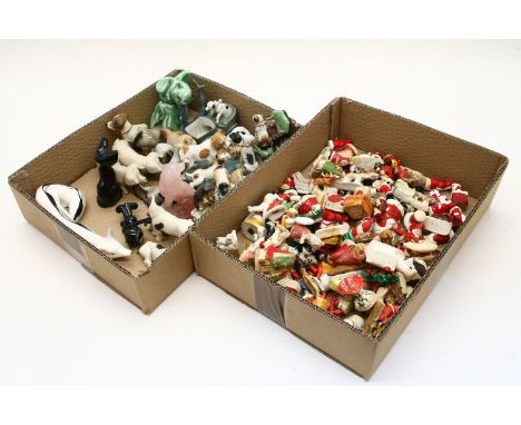 A pair of Royal Dux porcelain pigs, a collection of model dogs, other similar and a collection of vintage Christmas decoratio