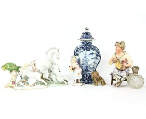 A collection of decorative ceramics, to include a lidded Delft vase, a Royal Worcester porcelain figure of a budgerigar, a Ro
