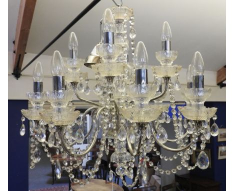 A pair of cut glass twelve light chandeliers, 64cm diameter and 85cm drop