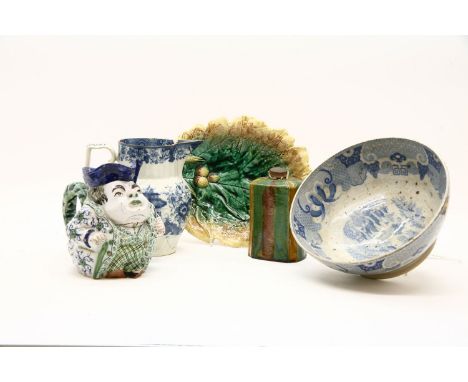 A pair of 19th century majolica leaf form dishes, 22 cm long, together with a green, yellow and brown glazed tea caddy, 15cm 