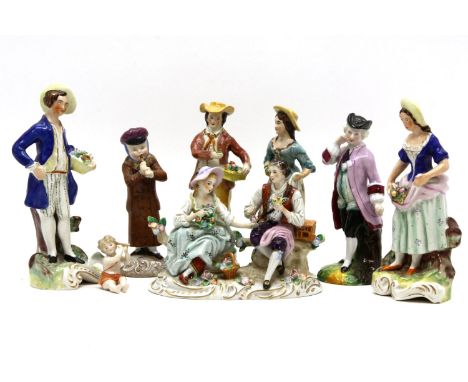 A 19th century Sitzendorf porcelain figure group of a courting couple sat on a tree trunk, 18cm wide x 13cm high, together wi