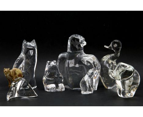 An Orefors glass model of a seated bear, 10.5cm high, together with a Val St Lambert glass model of a wolf, 18cm high, an Ore