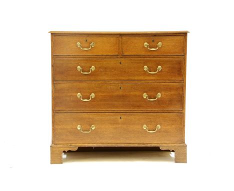 A George III oak chest of two short above three long drawers on bracket feet, 102cm wide x 48cm deep x 97cm high