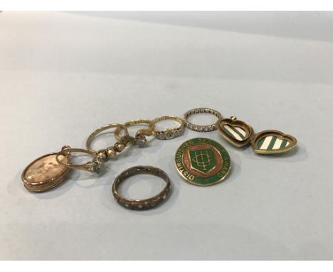 A 9ct gold enamel badge, 6.7g, and two 18ct gold rings, 5.2g etc.