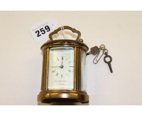 A small carriage clock (percussion pistol withdrawn)