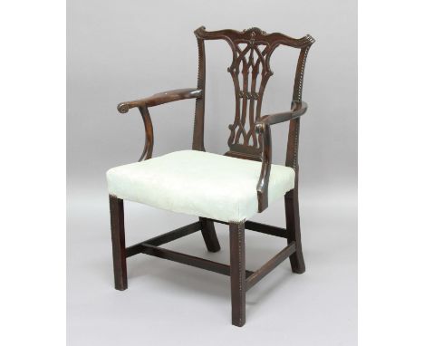 GEORGE III MAHOGANY ELBOW CHAIR, the back with Chippendale Gothic style pierced splat, out swept arms and stuffed over seat, 