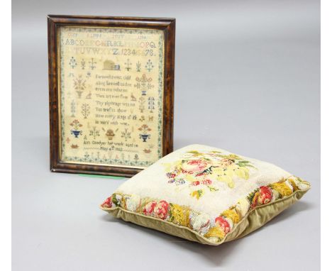 VICTORIAN SAMPLER, dated 1852, by Ann Goodyer, a rhyme beneath alphabets and surrounded by flowers, 40cm x 30cm; together wit