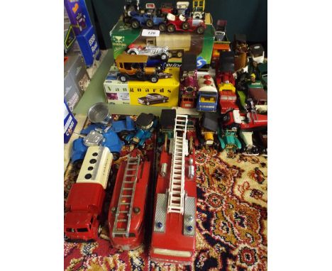 A Large Quantity of Boxed and Loose Die Cast Toys to include Fire Engines, Vintage Cars, Military Vehicles etc 