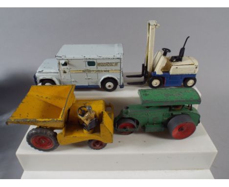 A Collection of Four Dinky Toys to include Road Roller, Fork Lift Truck, Armored Van and Dumper Truck