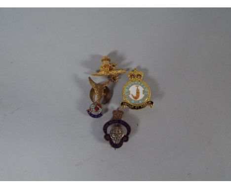 Two RAF Lapel Badges, an RAF Tie Pin and a British Legion Lapel Badge