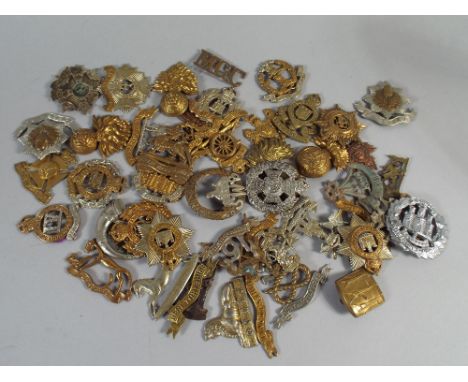 Forty five Assorted British Army Metal Badges, Lugs and Sliders Missing.