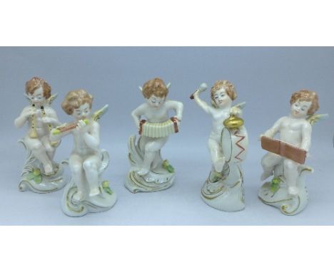 Five Neapolitan figures of putti playing instruments