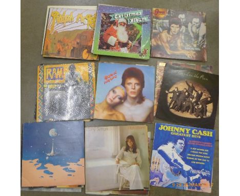 A collection of LP records including David Bowie, The  Who, Joni Mitchell, Neil Young, The Ozark Mountain Daredevils, Bob Dyl