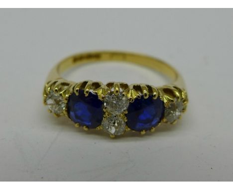 An 18ct gold, sapphire and diamond six stone ring, London 1911, 4.5g, R