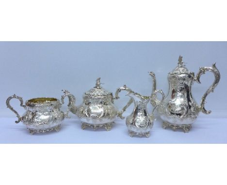 A Victorian silver four piece tea and coffee service, Sheffield 1860 and 1861, Martin Hall & Co., with monogram, crest and in