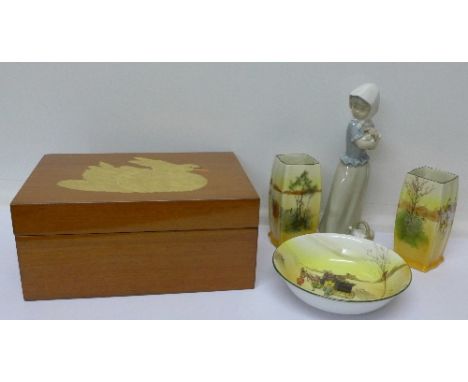 A pair of Royal Doulton Seriesware hunting scene vases and coaching scene bowl, a Nao figure of a girl holding a puppy, and a